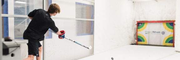 Young adult taking shots in a RapidShot